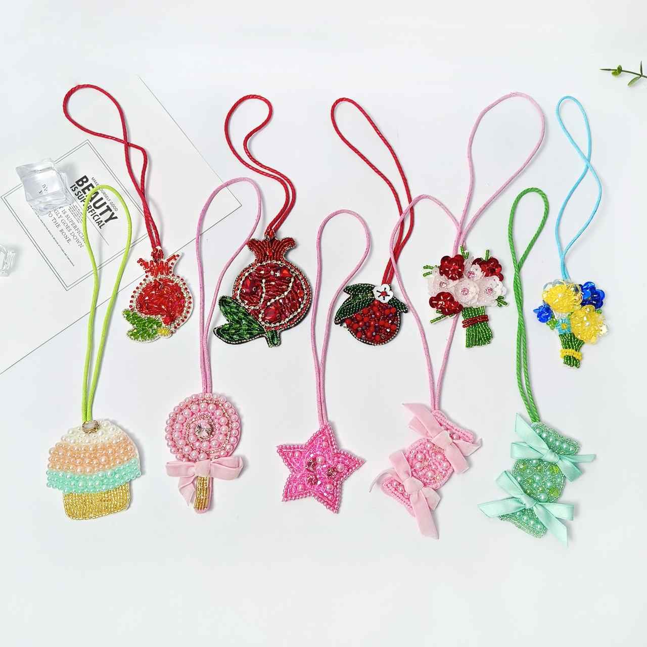 Set of handmade beaded embroidery appliques including cupcake star ice cream lollipop cherry designs