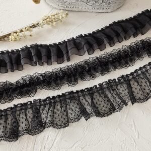 Black organza lace trim used to enhance collar designs with a ruffled effect