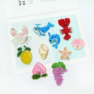 Set of handmade beaded embroidery appliques including lobster strawberry lemon grape seashell