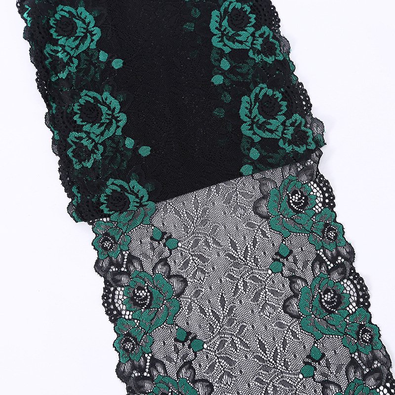 Detailed view of black elastic lace with floral embroidery, highlighting fine craftsmanship