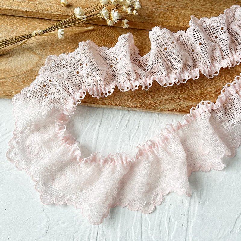 Beautiful pink ruffled lace for creating stunning accents on wedding dresses and skirts