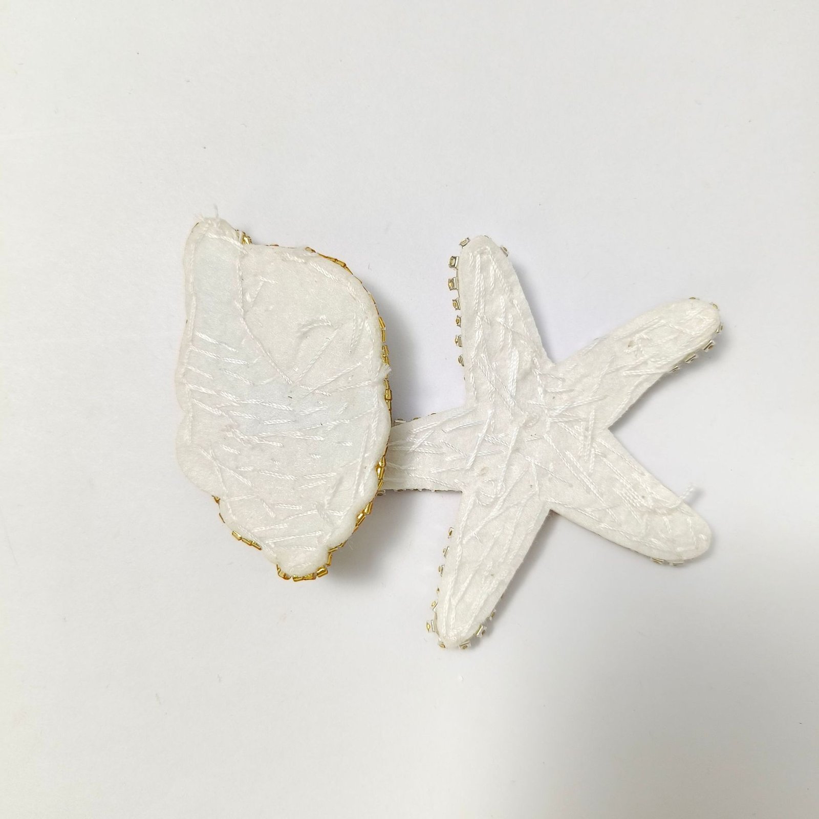 Backside view of handmade starfish embroidery pendant applique DIY lace craft accessory