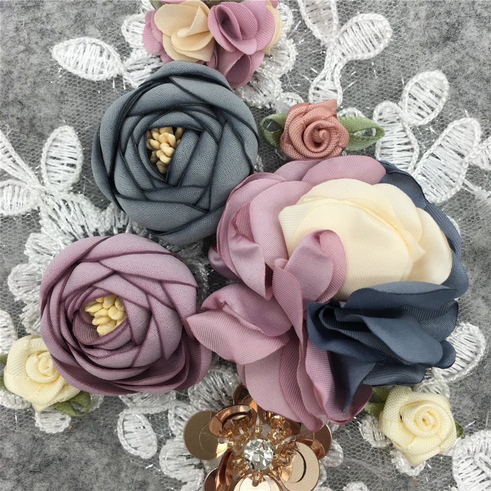 Close-up detail of 3D floral lace appliqué with sequins for sewing projects