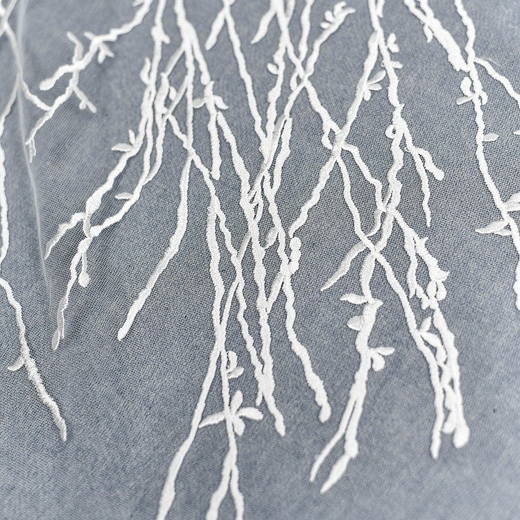Close-up of branch embroidery lace mesh trim fabric for handmade accessories
