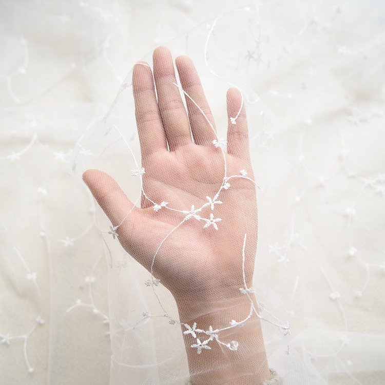 Delicate moon embroidered ivory lace trim fabric for veils, dresses and DIY projects