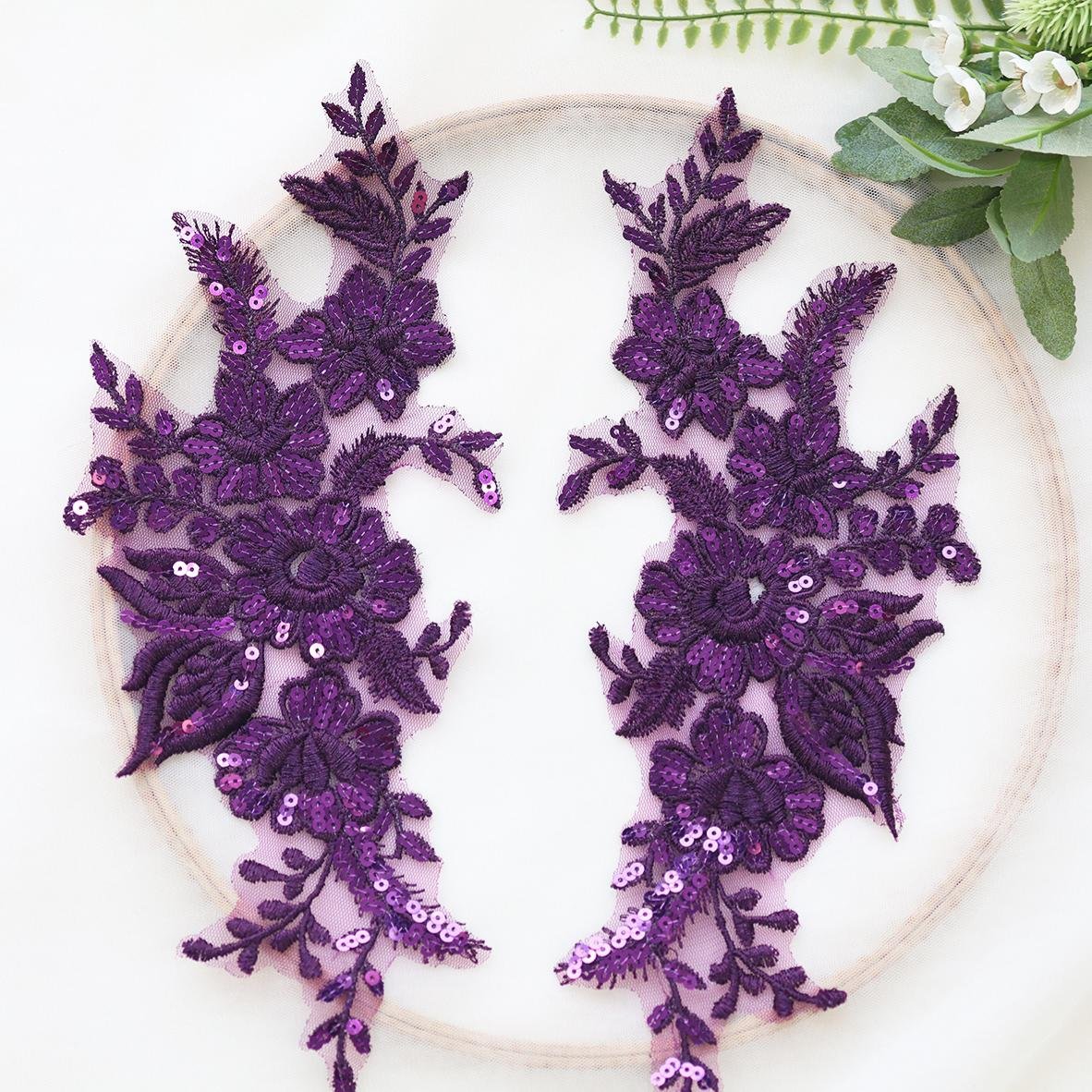 Purple sequin floral appliqué pair with raised embroidery and decorative sparkle